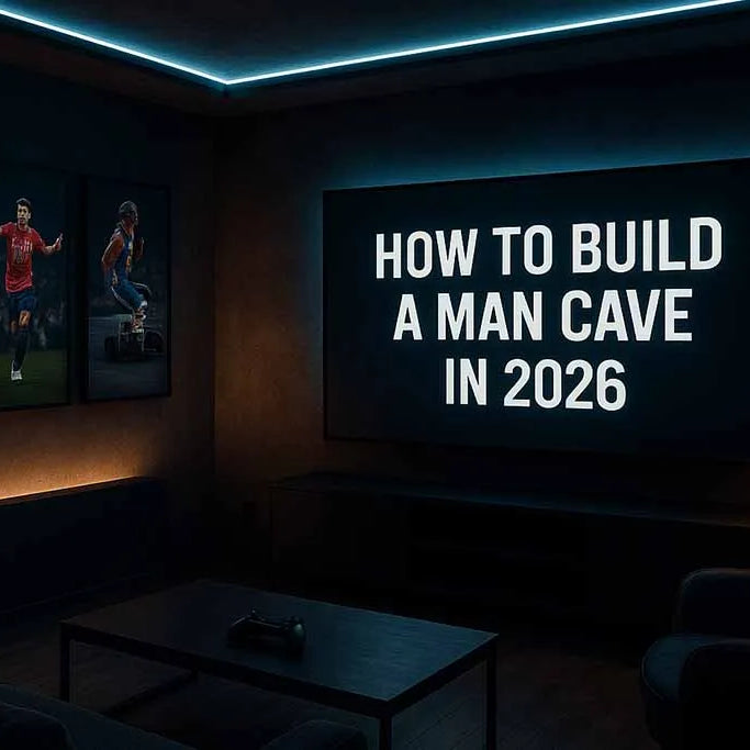 Modern sports man cave with framed wall art and LED lighting – banner for how to build a man cave in 2026
