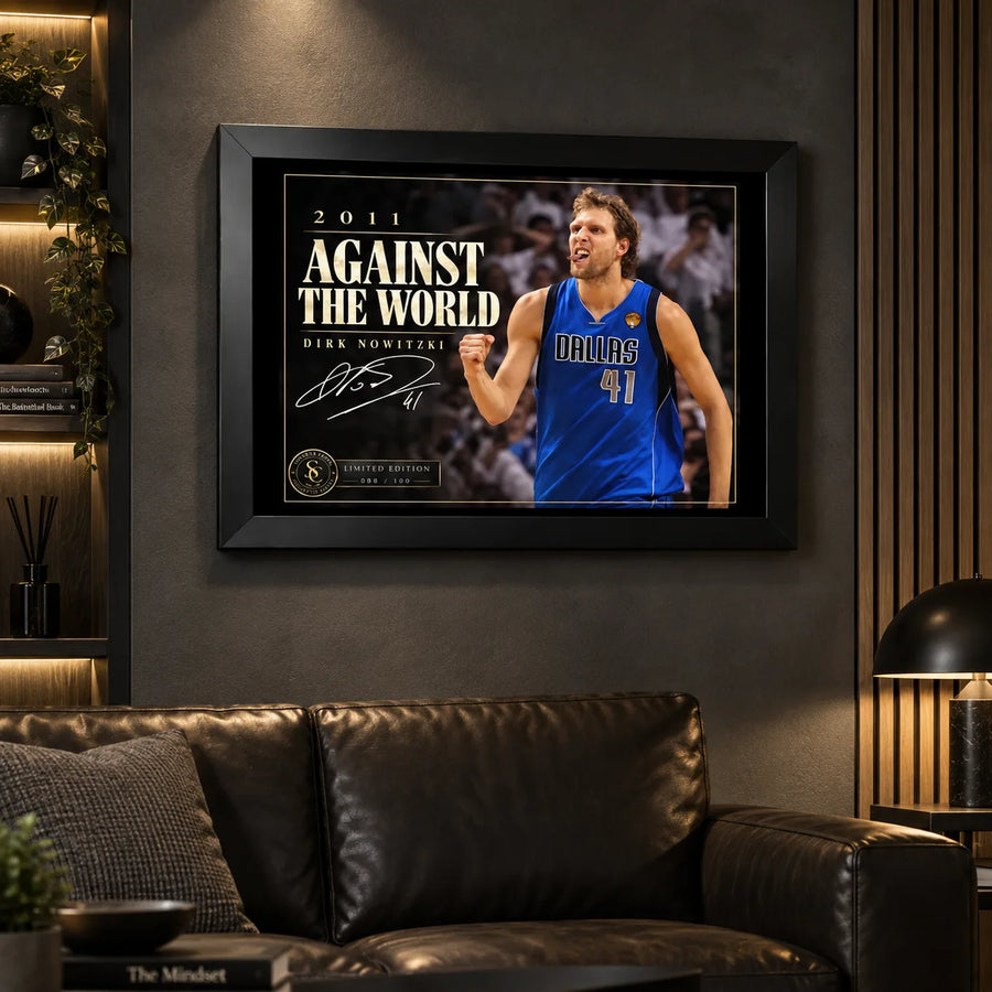 Dirk Nowitzki wall art displayed in a dark man cave setting with a black frame and warm ambient lighting.