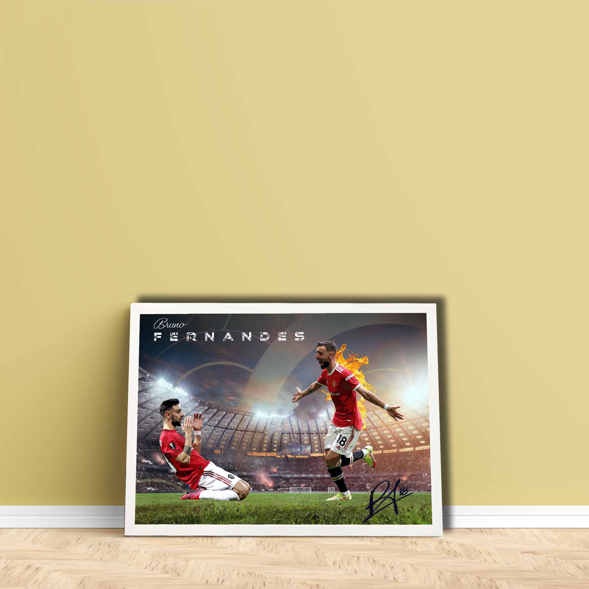 Manchester United fan with a framed print of Bruno Fernandez leaning on their wall.