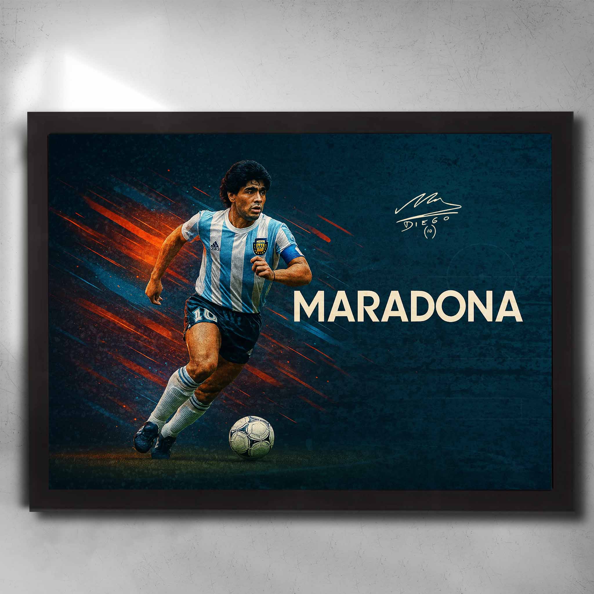 Black framed soccer art featuring a signed print of the legendary Diego Maradona playing for Argentina - Artwork by Sports Cave.