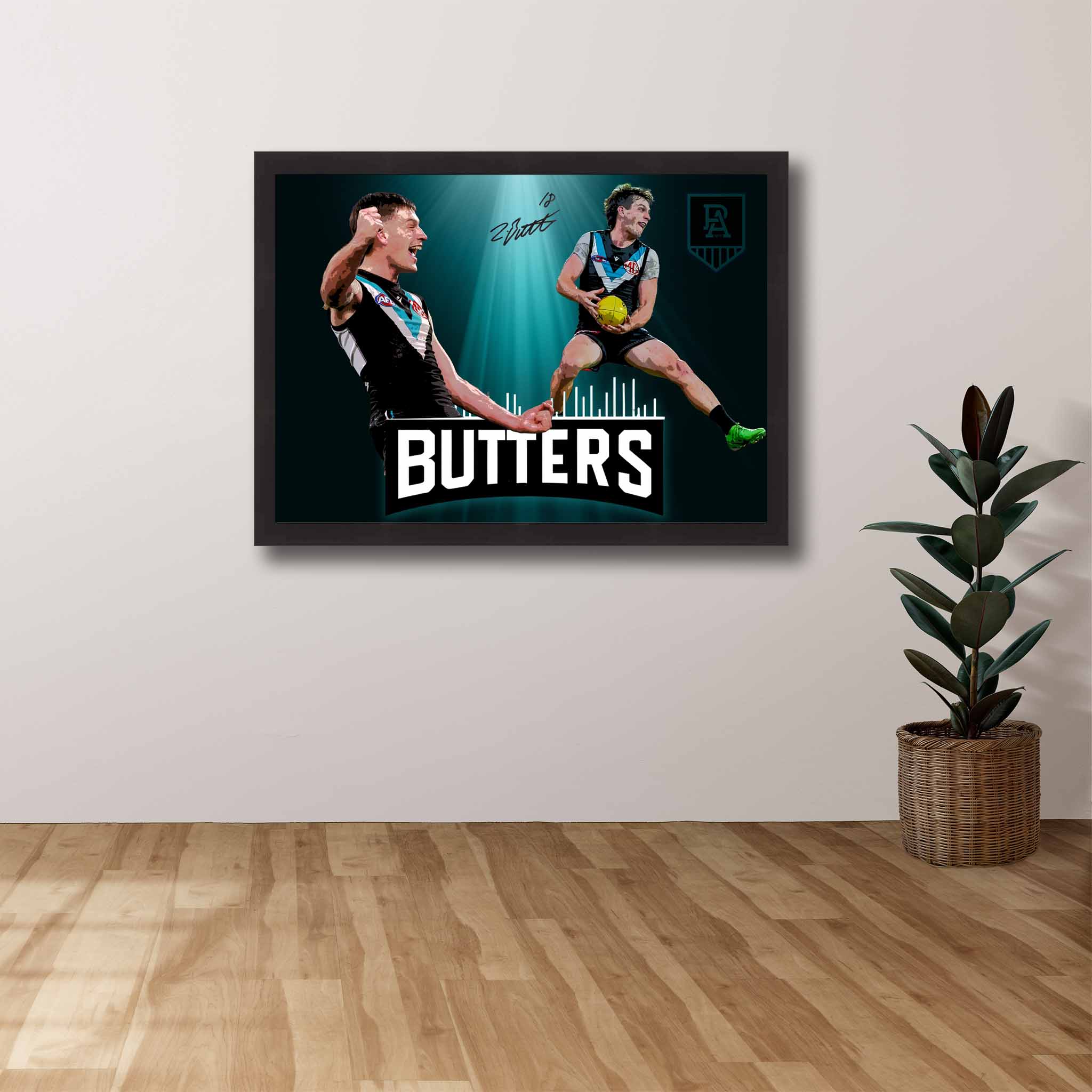 AFL Die-hard Supporters House, featuring a framed print of Zac Butters showcased on the wall.