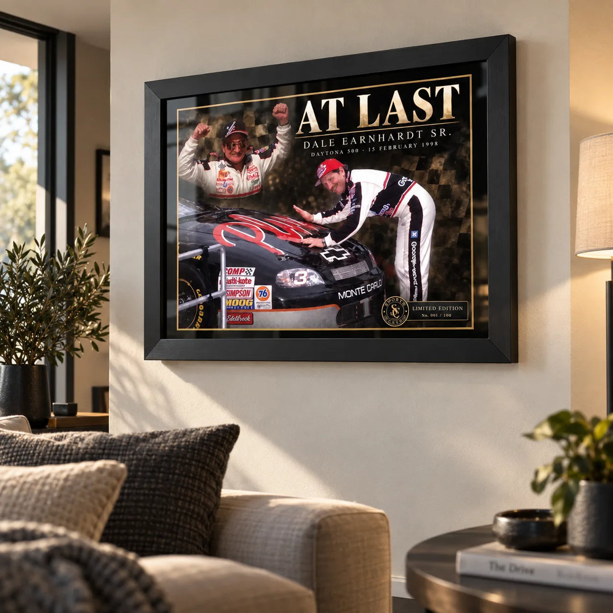 Dale Earnhardt Sr. At Last wall art displayed in a bright living room with a black frame.