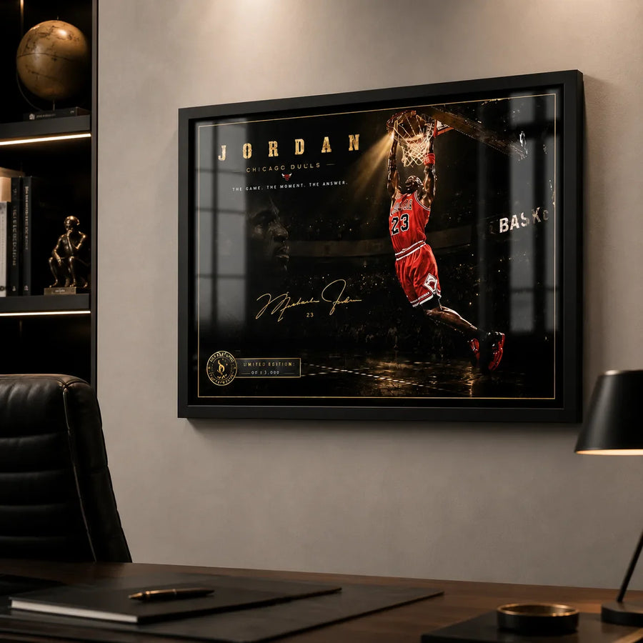 Basketball dunk wall art displayed in a black frame on a modern office wall above a wooden desk.