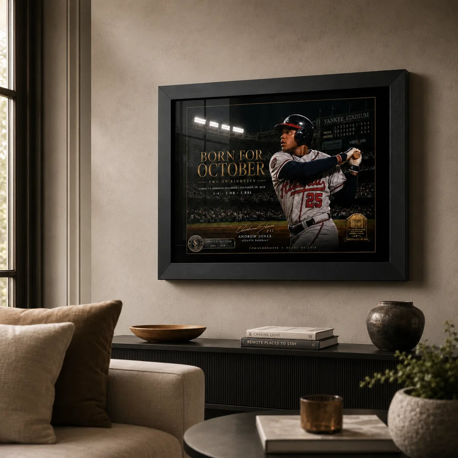Born for October Andruw Jones wall art displayed in a warm living room above a low cabinet in a black frame.