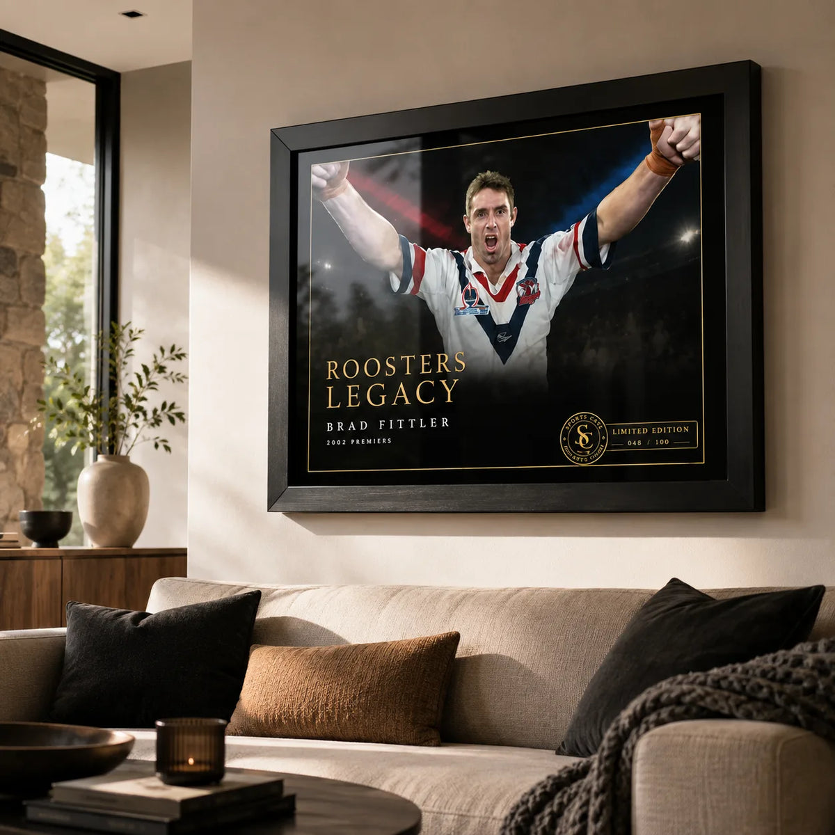 Brad Fittler wall art displayed in a contemporary living room, with the black framed Roosters Legacy tribute above a sofa.