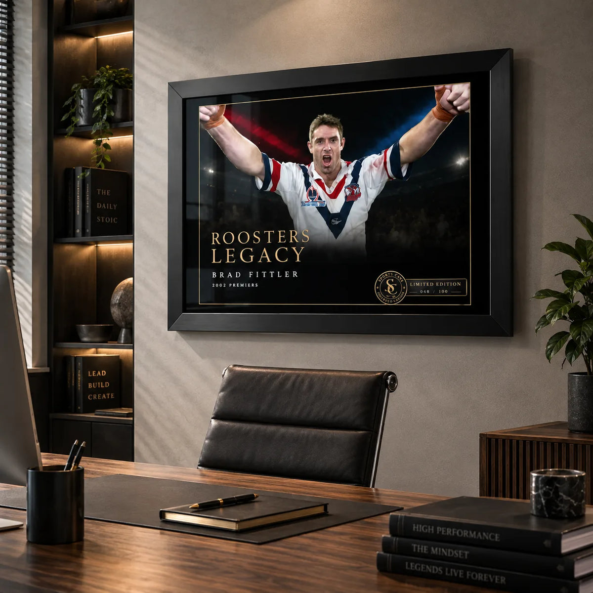 Brad Fittler wall art displayed in a modern office, with the black framed Roosters Legacy tribute above a timber desk.