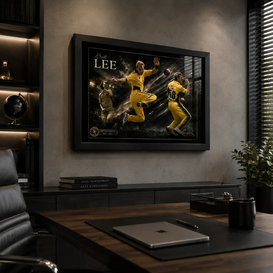 Black framed Brett Lee cricket wall art displayed in a premium home office above a timber desk.