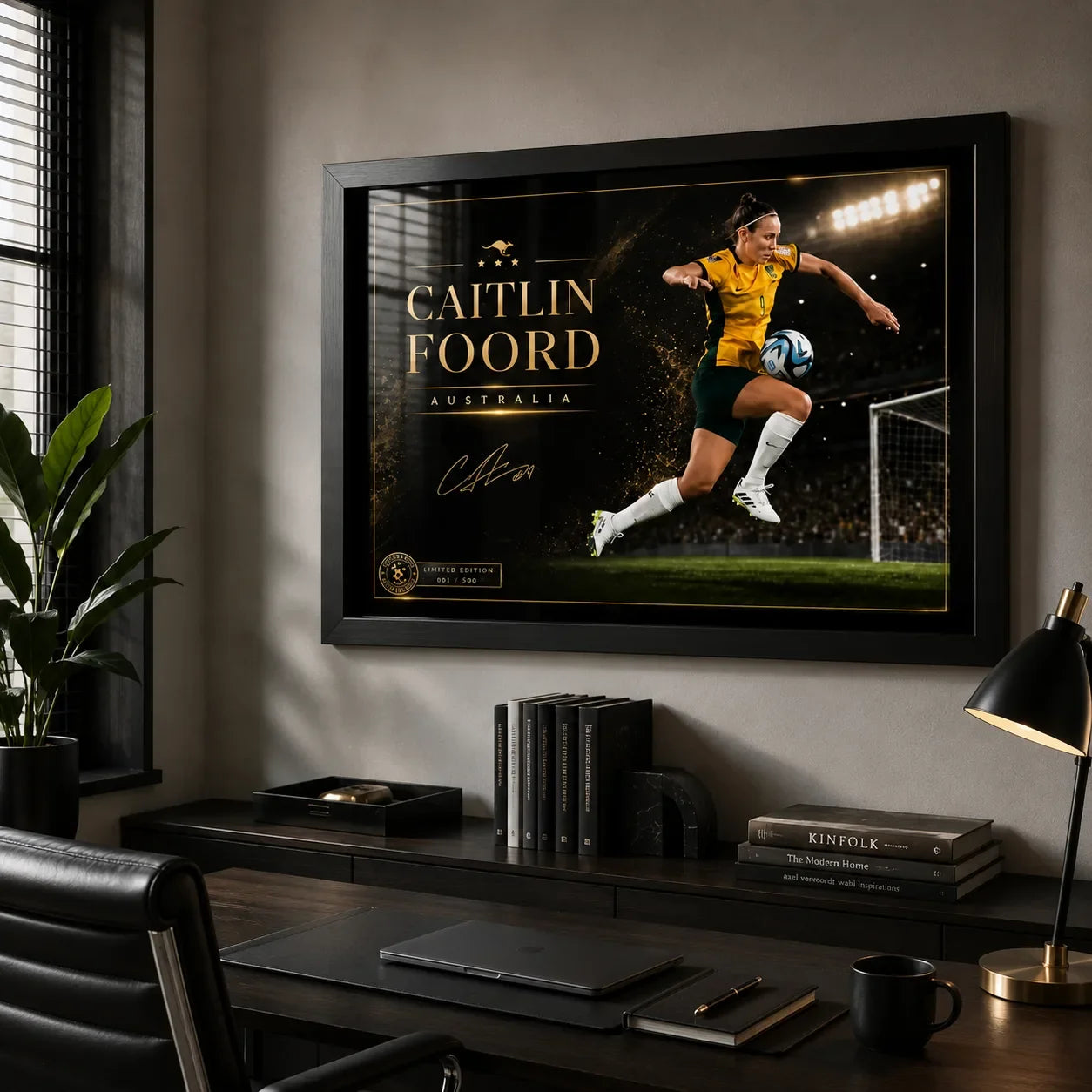 Caitlin Foord soccer wall art in a black frame displayed above a desk in a modern home office.