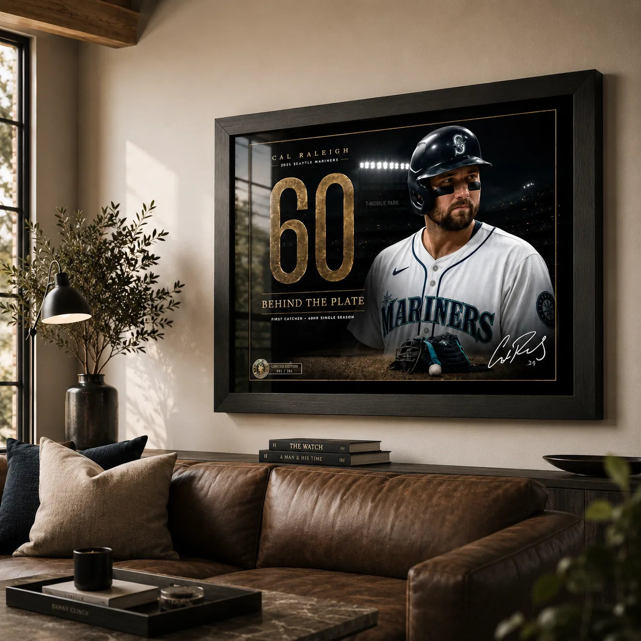 Cal Raleigh 60-homer wall art displayed above a leather sofa in a warm contemporary living room.