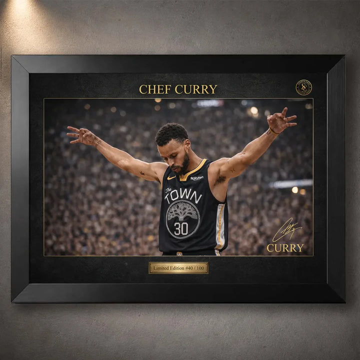 Chef Curry basketball wall art in a black frame, showing the player artwork with gold detailing and edition plaque.