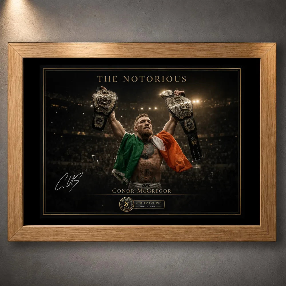 Oak framed Conor McGregor wall art featuring The Notorious beneath arena lights with both championship belts raised.