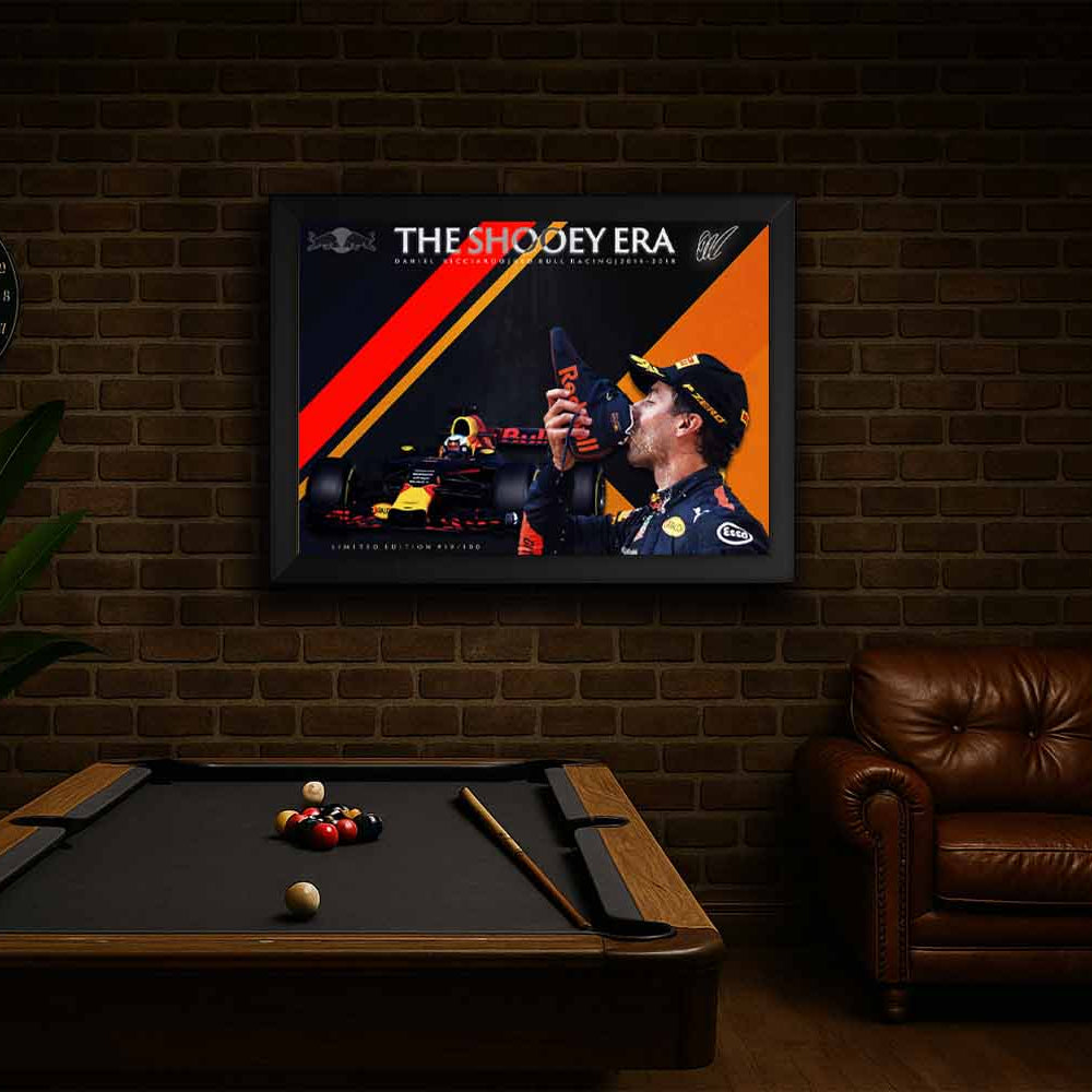 Daniel Ricciardo framed sports memorabilia print displayed in a man cave setting, featuring his iconic Red Bull Racing shoey moment.