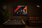Daniel Ricciardo framed sports memorabilia print displayed in a man cave setting, featuring his iconic Red Bull Racing shoey moment.