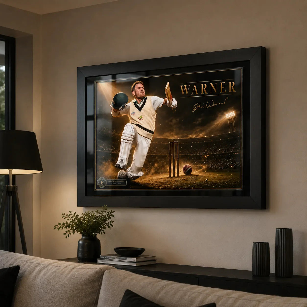 David Warner cricket wall art in a black frame displayed in a warm premium living room with restrained neutral decor.