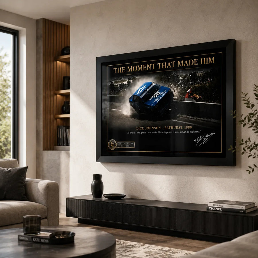 Dick Johnson Bathurst 1980 wall art in a neutral living room with timber shelving and a low black console.