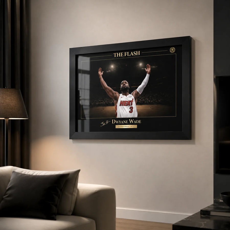 Black framed basketball wall art displayed in a modern living room with soft lighting and neutral walls.
