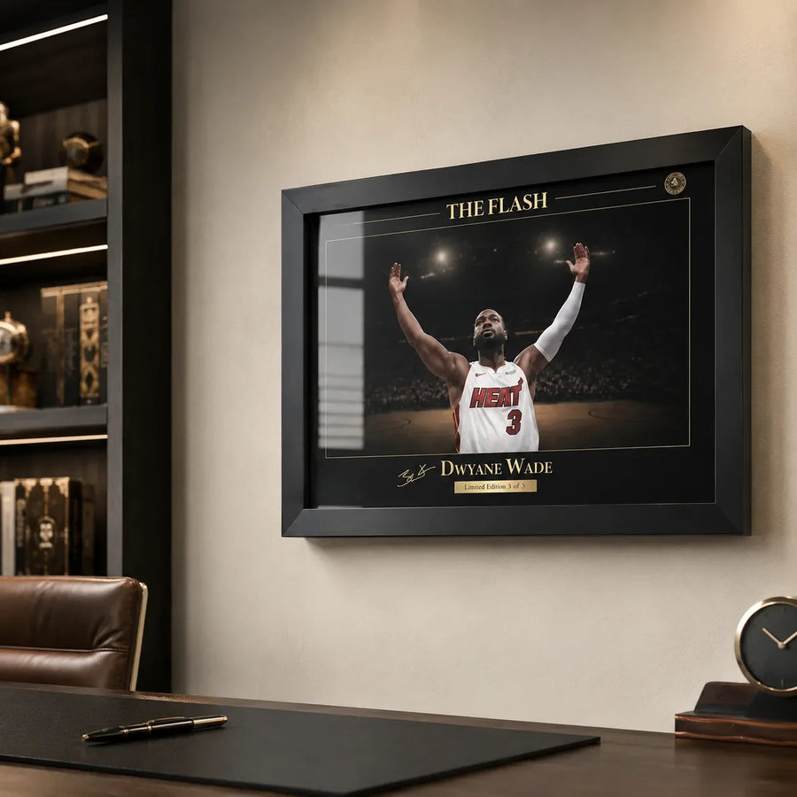 Black framed basketball wall art shown in a refined office with warm shelving and desk details.