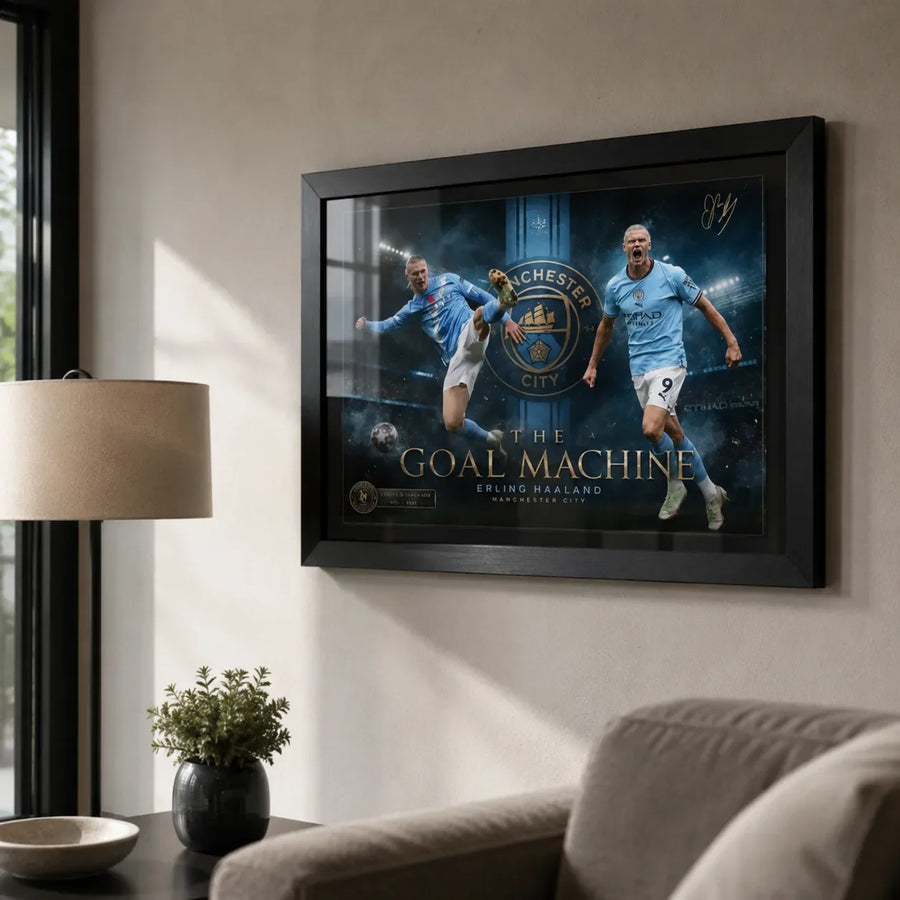 Erling Haaland Manchester City wall art in a black frame displayed on a warm modern living room wall.