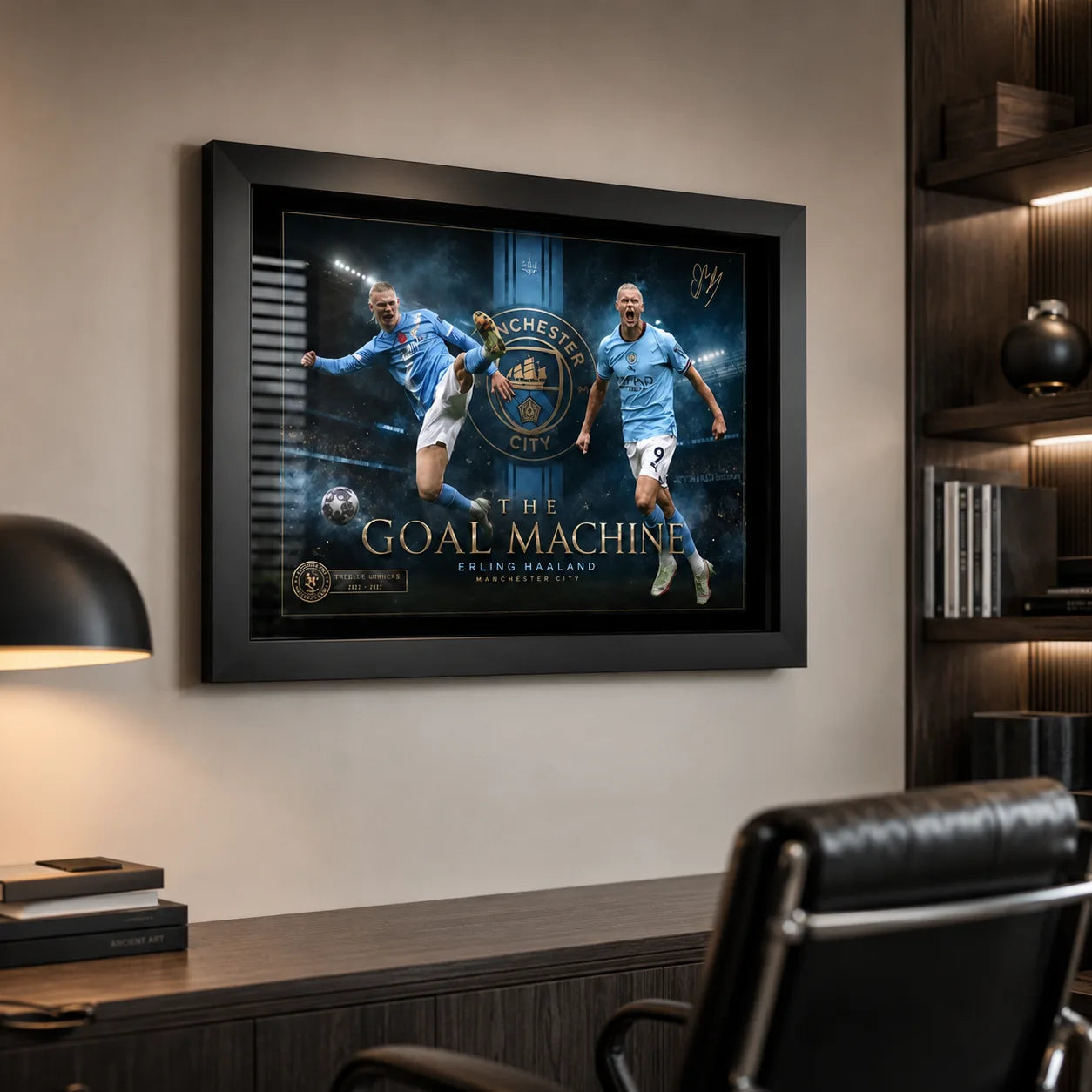 Erling Haaland Manchester City wall art in a black frame displayed in a modern office with shelving.