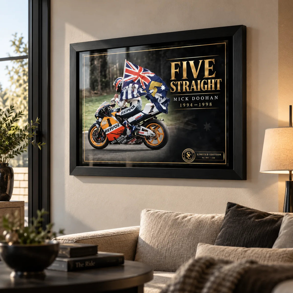 Mick Doohan Five Straight wall art displayed in a bright living room with a black frame above a neutral sofa.