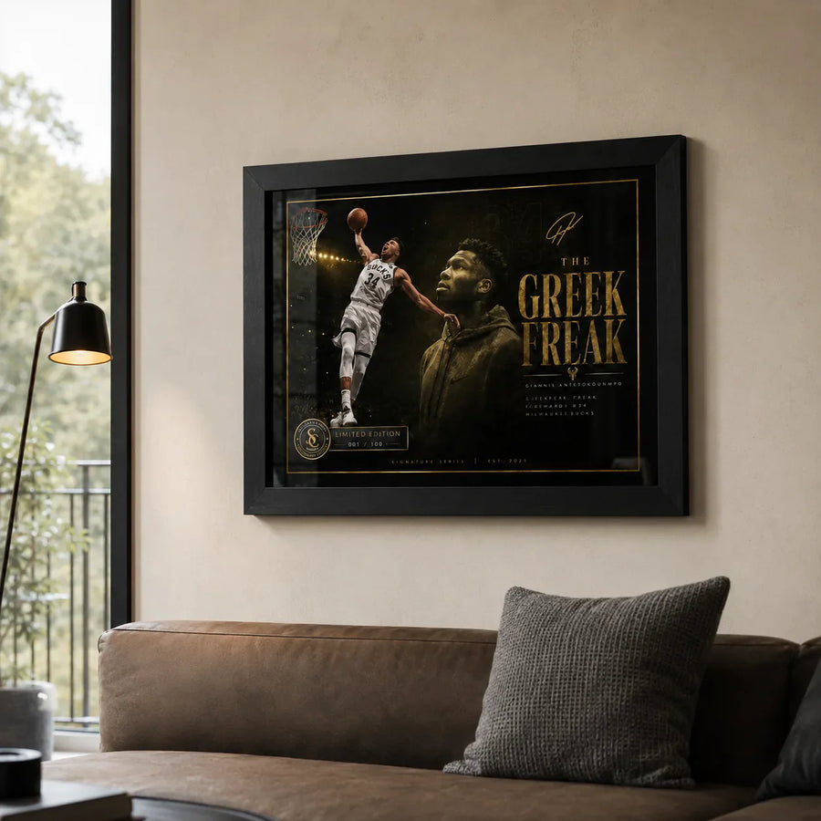 Giannis Antetokounmpo basketball wall art displayed above a brown sofa in a warm modern living room.