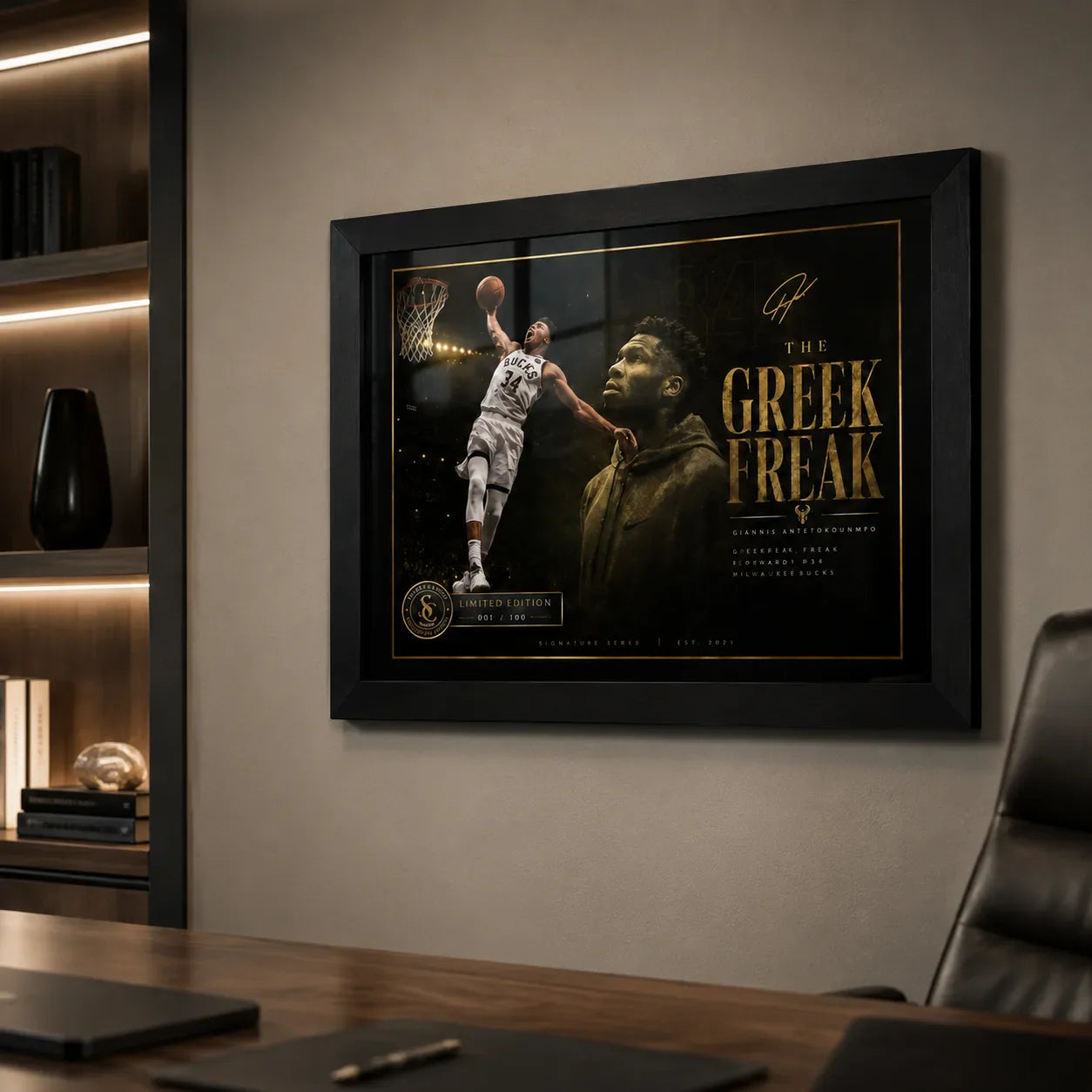 Giannis Antetokounmpo Greek Freak wall art in a black frame displayed on a modern office wall.