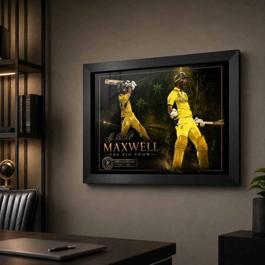 Glen Maxwell cricket wall art in a black frame mounted above a desk in a clean premium home office setting.