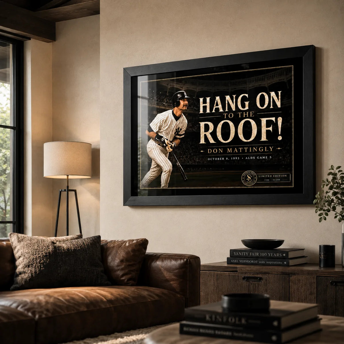 Don Mattingly wall art displayed in a warm living room, presented in a black frame above a leather sofa.