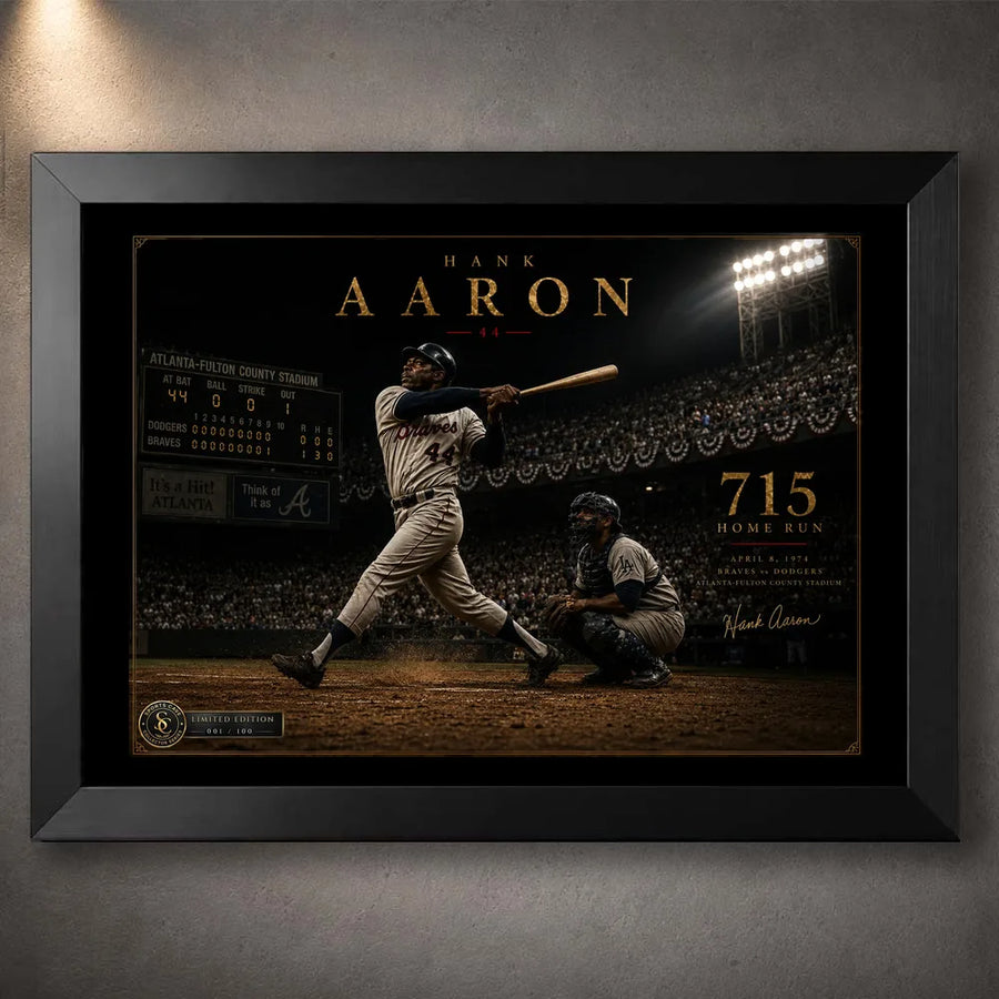 Hank Aaron 715th home run baseball wall art shown in a premium black frame against a softly lit concrete wall.