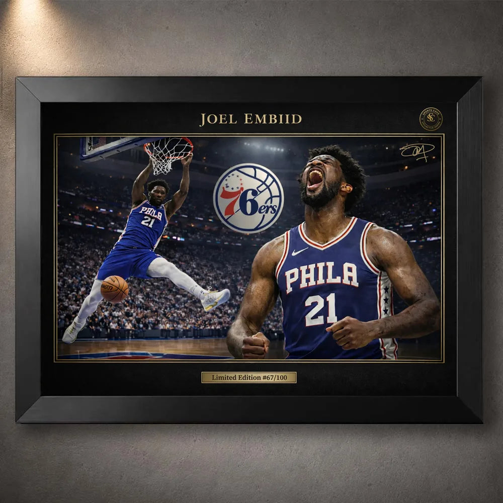 Joel Embiid 76ers NBA wall art shown in a black frame with gold trim and arena action artwork.