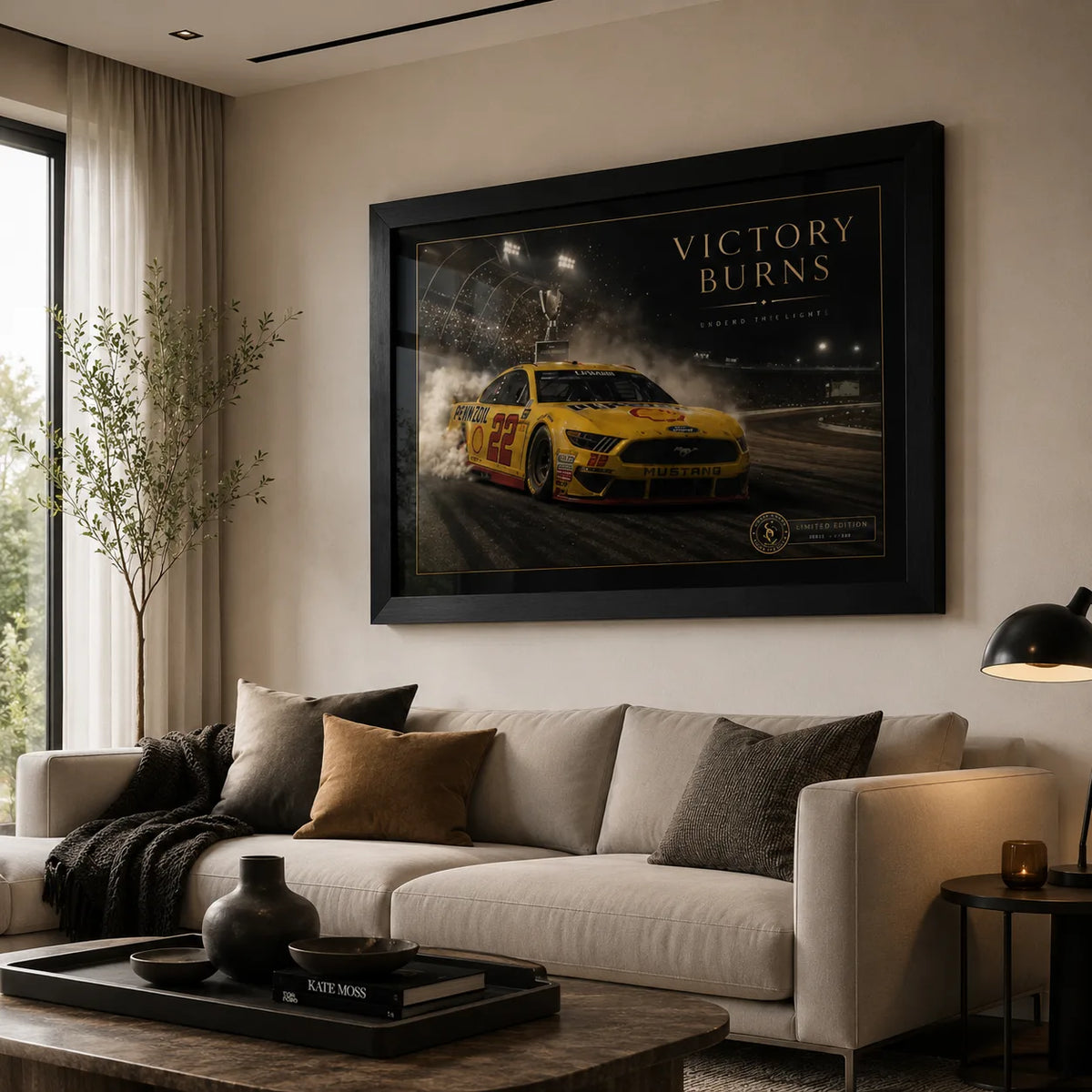 Victory Burns Joey Logano wall art displayed above a neutral sofa in a premium modern living room.
