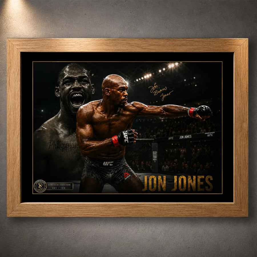 Jon Jones UFC wall art shown in an oak timber frame with black matting and gold detailing on a textured grey wall.