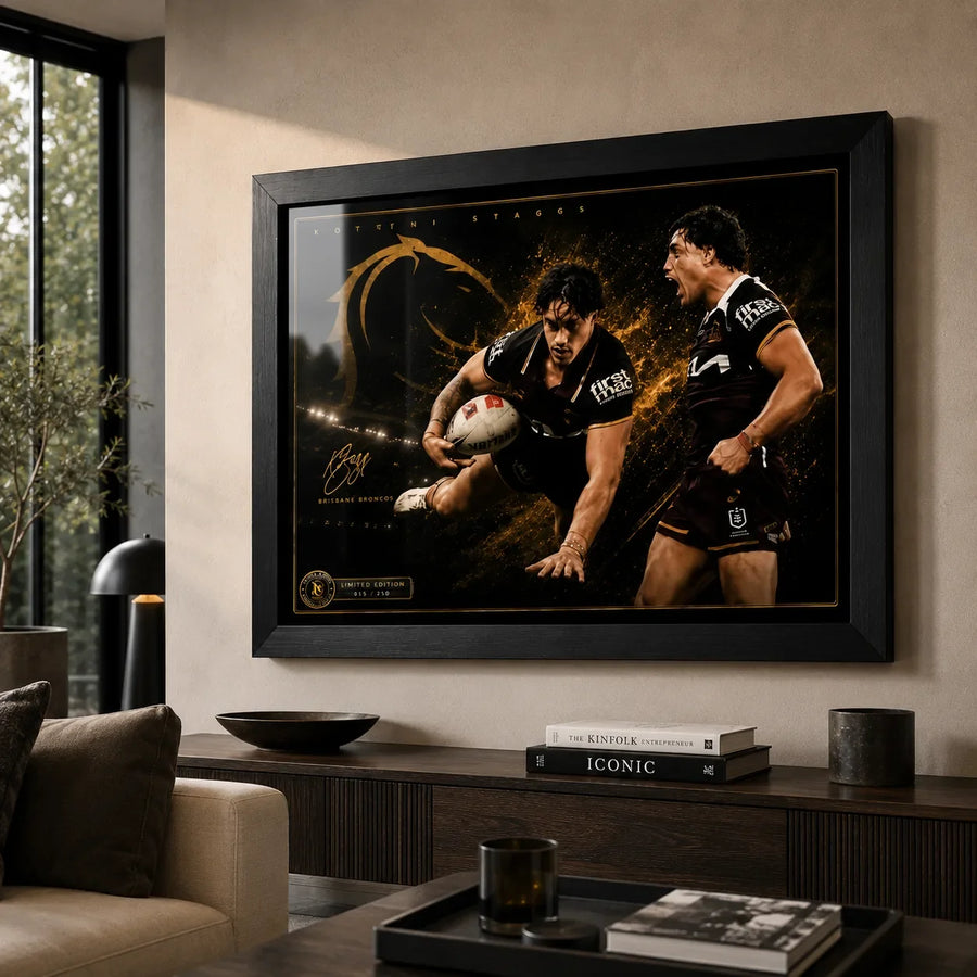 Kotoni Staggs Brisbane Broncos rugby league wall art in a black frame above a timber console in a warm modern living room.