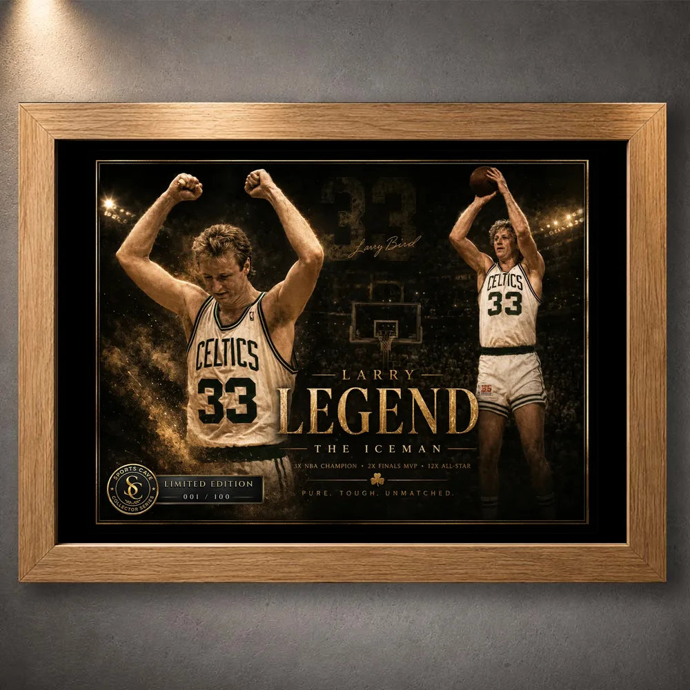 Larry Bird wall art in an oak frame showing Celtics number 33 tribute artwork against a dark textured wall.