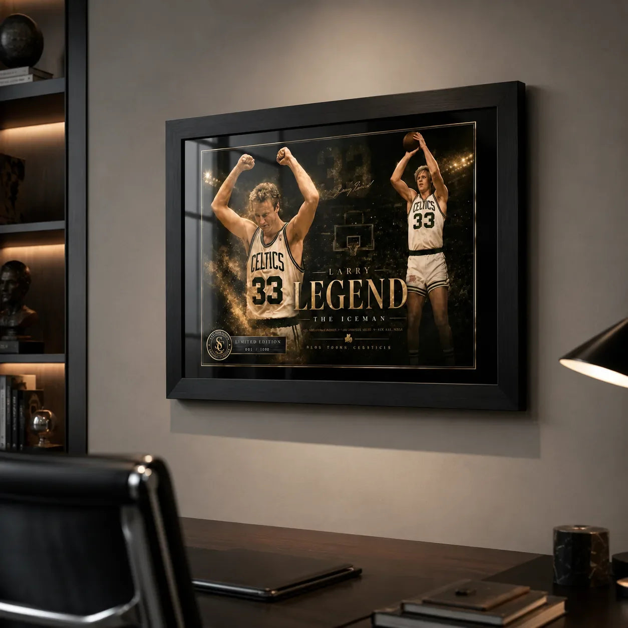 Larry Bird wall art in black frame mounted in a dark home office with shelving, desk, and warm lighting.