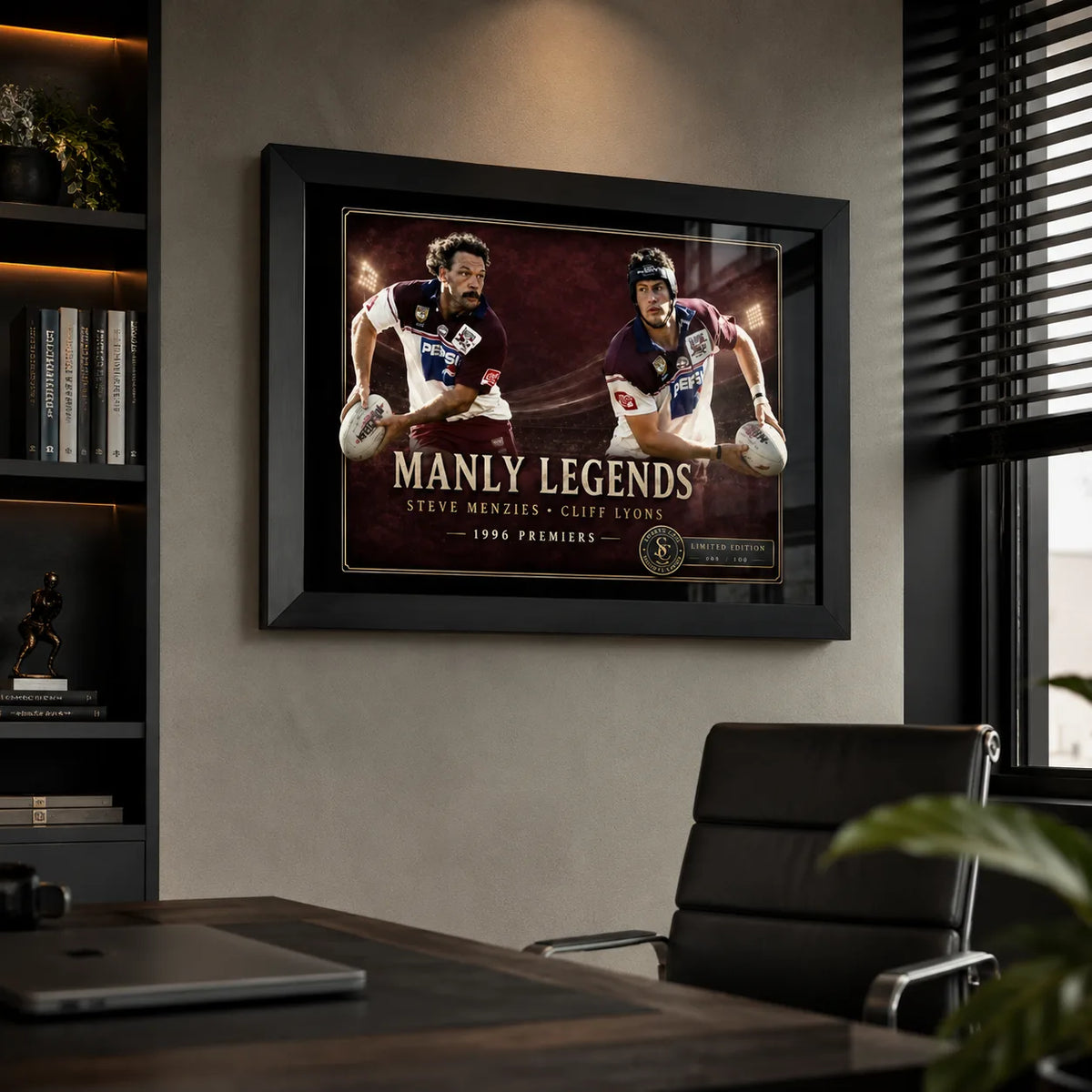 Manly Legends Steve Menzies and Cliff Lyons wall art displayed in a modern office with a black frame.