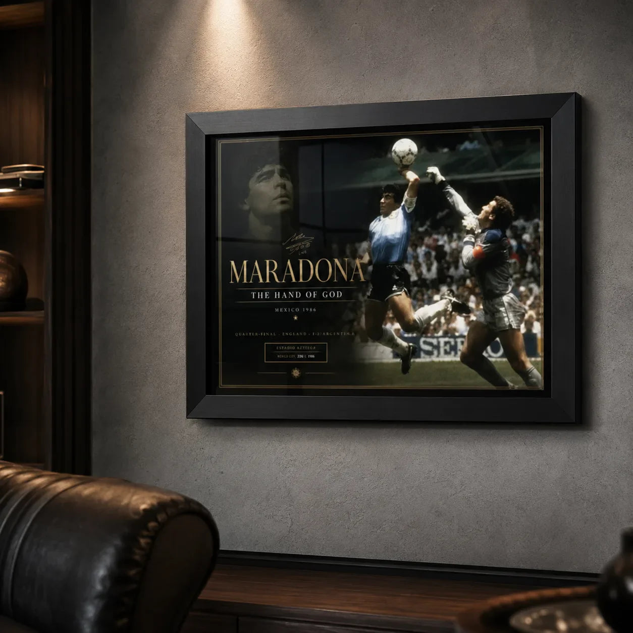 Diego Maradona soccer wall art in a black frame on a dark man cave wall with leather seating.