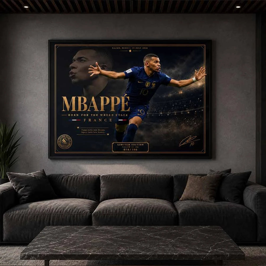 Modern luxury man cave featuring a framed Kylian Mbappé sports poster above a dark charcoal sofa with ambient lighting and minimalist interior styling.