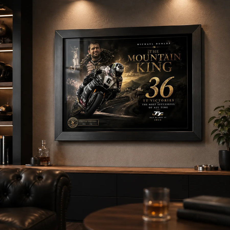 Michael Dunlop motorsport wall art in a dark premium man cave with warm lighting and collector styling.