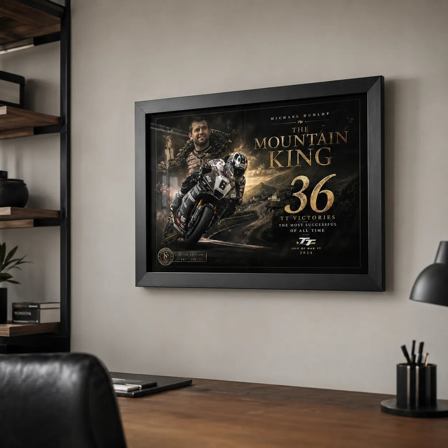 Michael Dunlop Mountain King wall art above a timber desk in a refined home office for motorcycle racing fans.