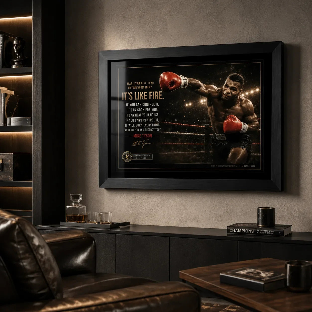 Mike Tyson Fear Is Like Fire framed boxing artwork displayed in a dark man cave with leather seating and warm shelf lighting.