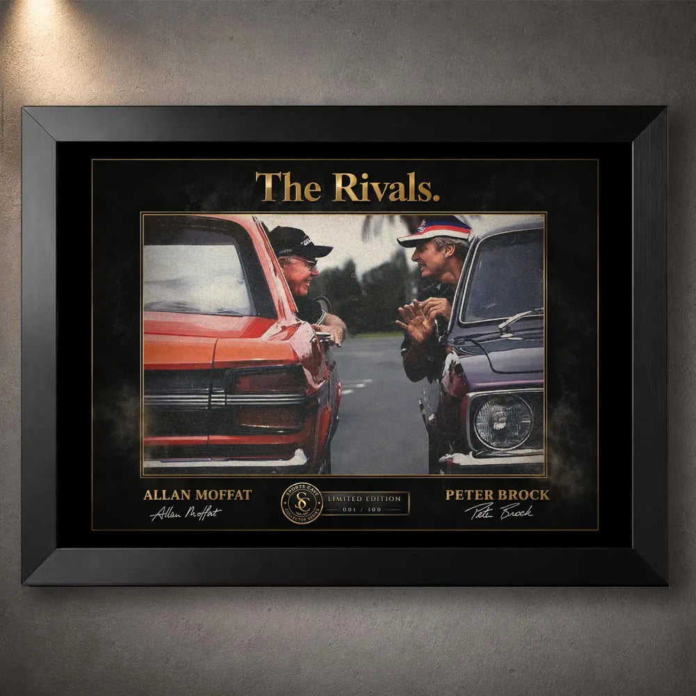 Motorsport rivalry wall art in a black frame with gold typography and racing artwork