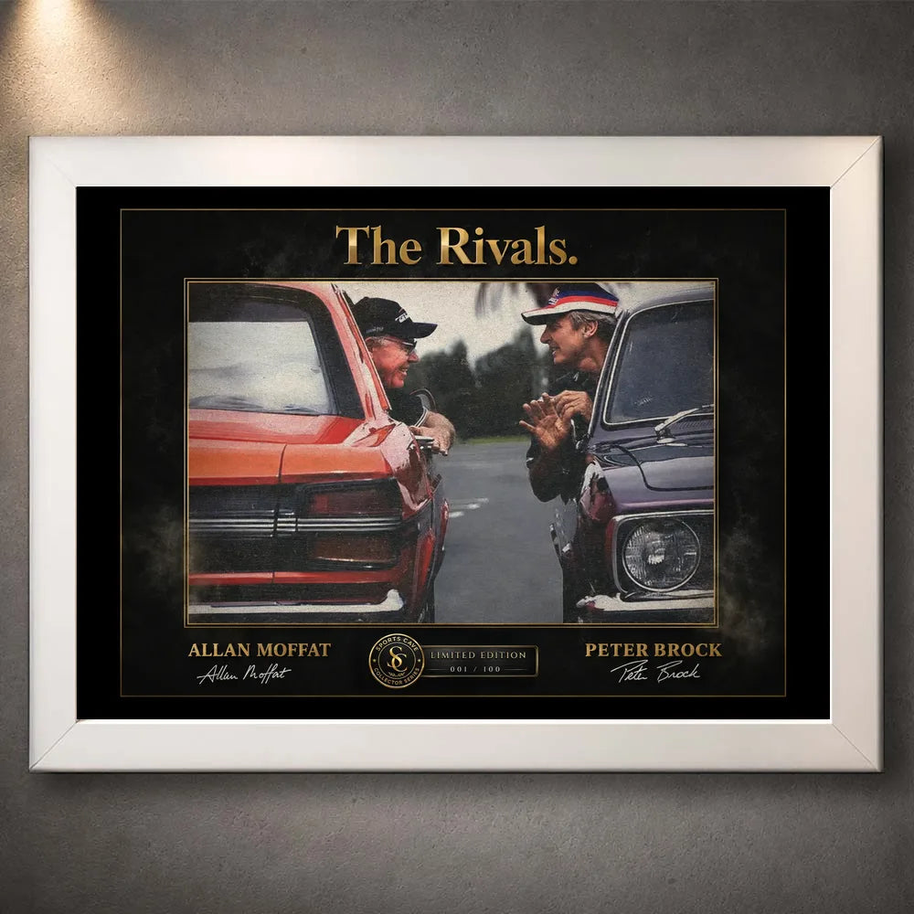 Motorsport rivalry wall art shown in a white frame on a textured grey wall