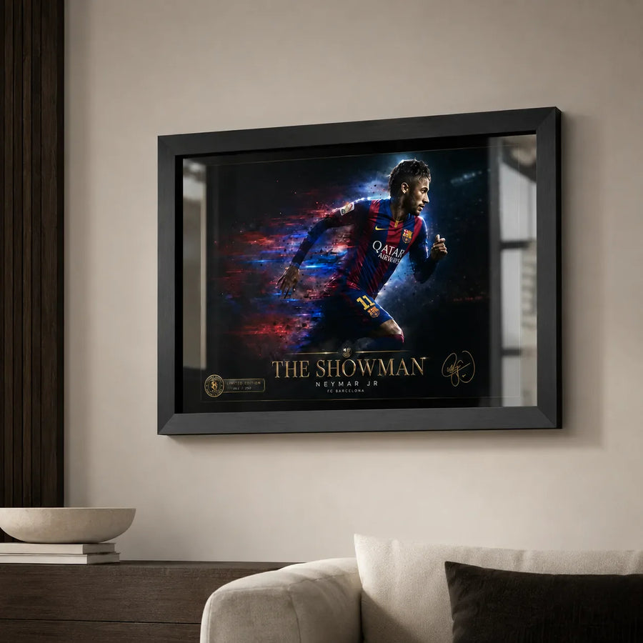 Black framed Neymar Jr Barcelona wall art displayed in a neutral living room above a sofa and timber console.