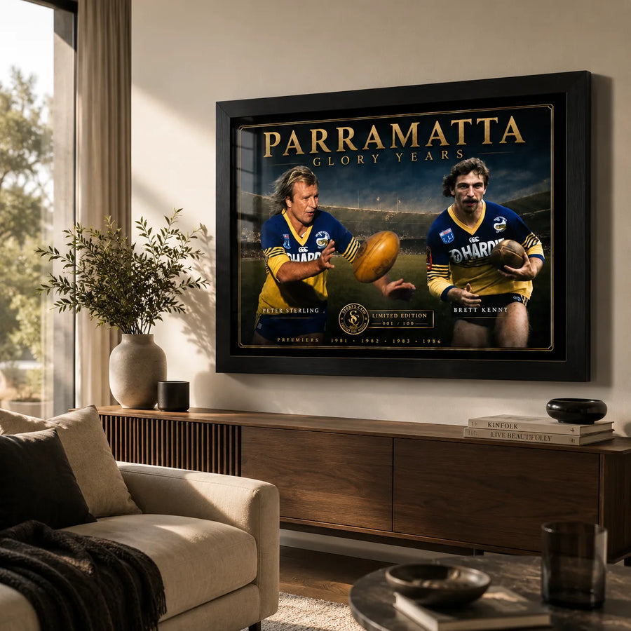 Peter Sterling and Brett Kenny Parramatta wall art displayed in a warm living room above a timber cabinet.