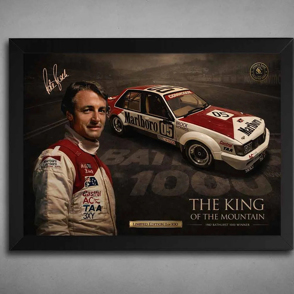 Black-framed Peter Brock Bathurst 1000 Holden Commodore poster, premium sports collectibles shown on grey wall.