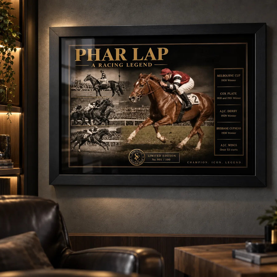 Black framed Phar Lap horse racing wall art displayed in a dark man cave with leather seating and warm ambient lighting.