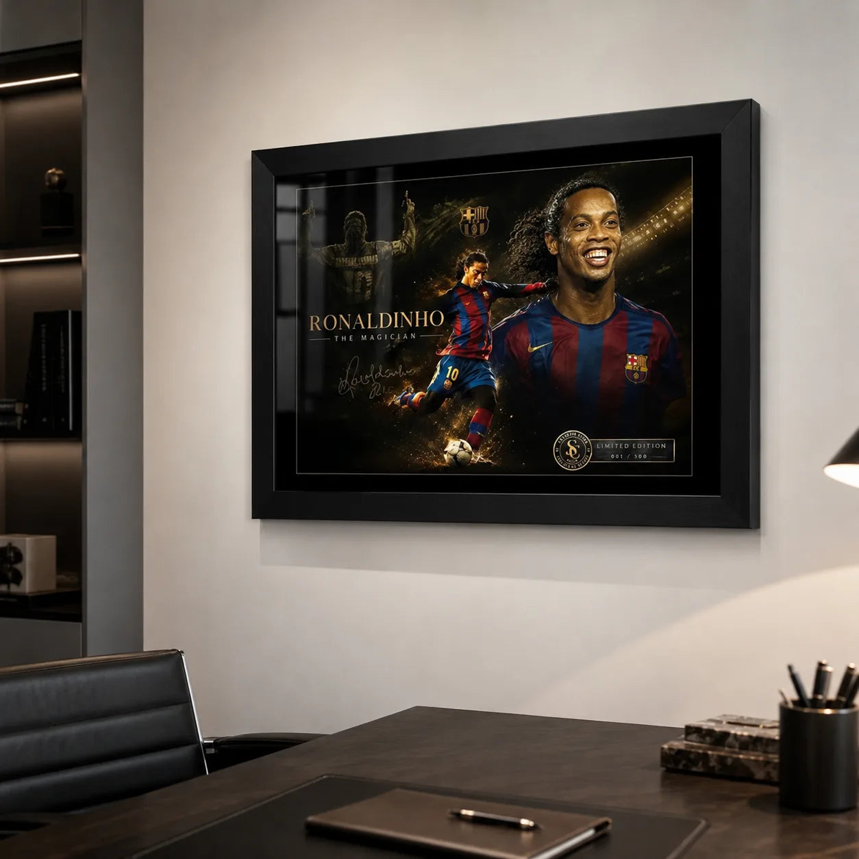 Black framed Ronaldinho soccer wall art displayed on a modern office wall above a dark desk.