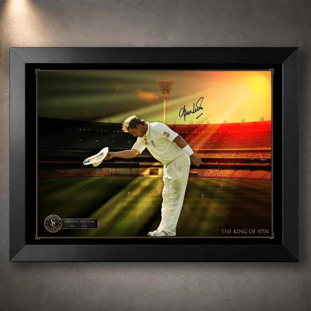 Black framed Shane Warne cricket wall art showing his bowing tribute beneath warm stadium light.
