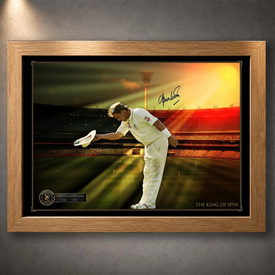 Oak framed Shane Warne cricket wall art showing his bowing tribute beneath warm stadium light.